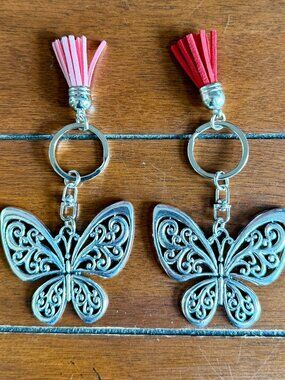 NEW 2-Pc Silvery Hollow Butterfly Keychain with Pink Tassel & Red Tassel Charm